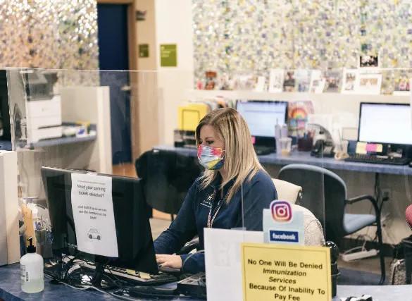 a woman receptionist at a computer