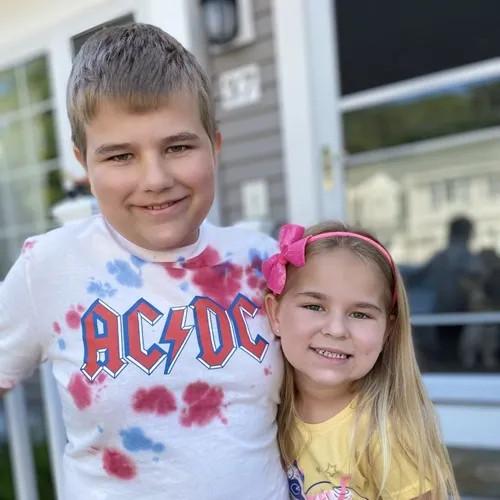 a boy and girl hugging